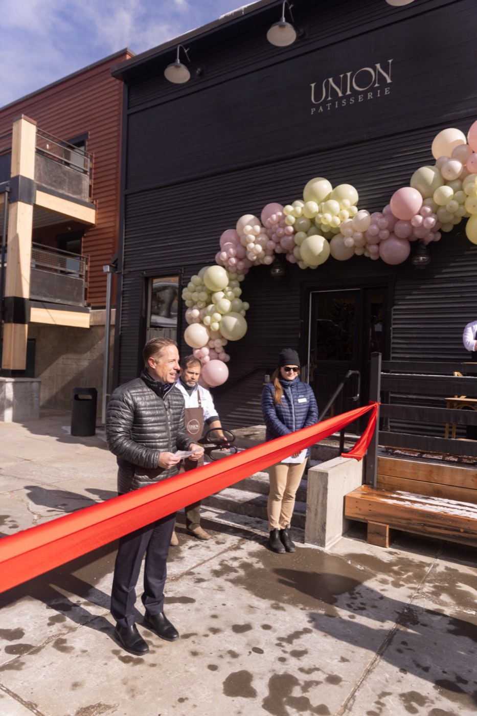 A patisserie storefront dressed for its grand opening