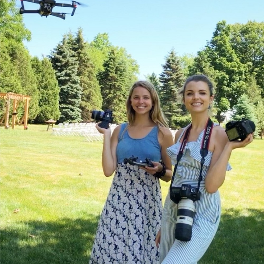 Sabrina and Andrea Boehlke outdoors with their cameras