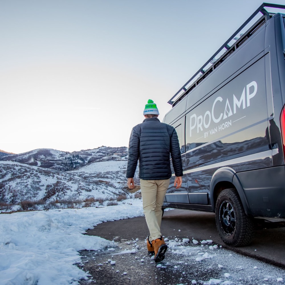 A crew member beside the production van
