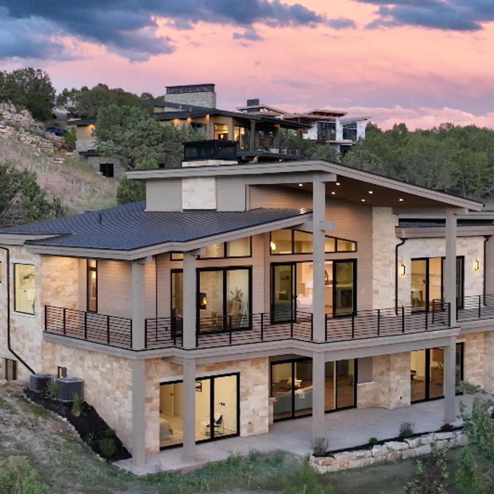 A modern mountain property at dusk